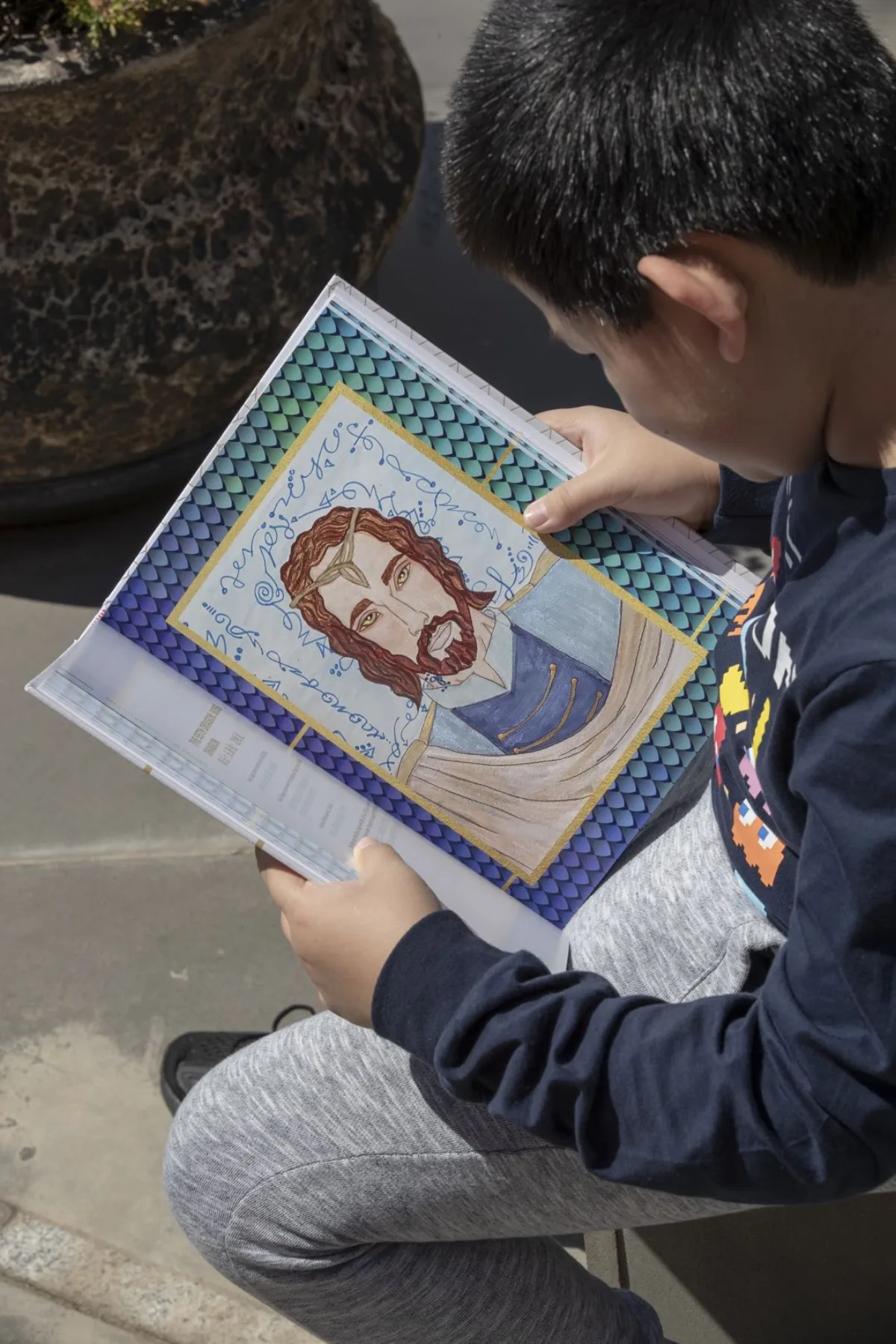 A child reading an illustrated book
